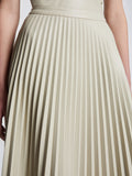 Detail image of model wearing Faux Leather Pleated Skirt in CHALK