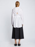 Back full length image of model wearing Soft Poplin Button Down Shirt Dress in OFF WHITE
