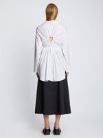 Back full length image of model wearing Soft Poplin Button Down Shirt Dress in OFF WHITE
