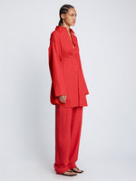 Side full length image of model wearing Soft Poplin Button Down Shirt Dress in CHERRY