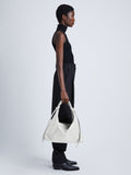 Image of model wearing Large Drawstring Shoulder Bag in OPTIC WHITE