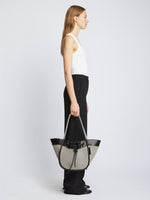 Image of model carrying Canvas Large Ruched Tote in BLACK/ECRU