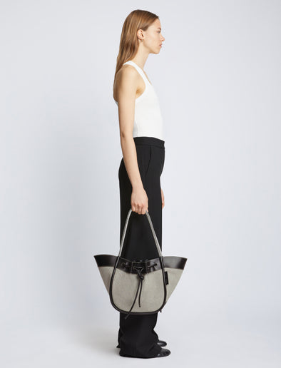Image of model carrying Canvas Large Ruched Tote in BLACK/ECRU
