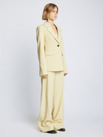 Side full length image of model wearing Viscose Suiting Jacket in PARCHMENT