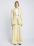 Front full length image of model wearing Viscose Suiting Jacket in PARCHMENT with jacket open and white t-shirt underneath