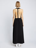 Back full length image of model wearing Matte Crepe Twist Back V-Neck Dress in BLACK