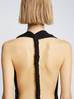 Detail image of model wearing Matte Crepe Twist Back V-Neck Dress in BLACK