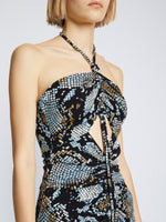 Detail image of model wearing Printed Snake Crepe De Chine Halter Dress in BLACK MULTI