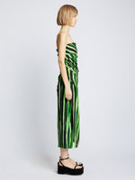Side full length image of model wearing Painted Stripe Strapless Dress in FATIGUE MULTI