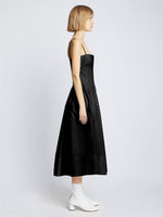Side full length image of model wearing Eco Poplin Pintuck Dress in BLACK