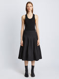Front image of model in Eco Poplin Wrap Skirt in black