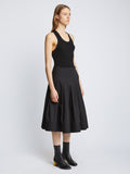 Side image of model in Eco Poplin Wrap Skirt in black