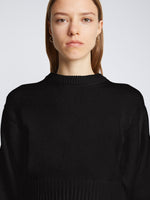 Detail image of model wearing Textured Cotton Sweater in BLACK
