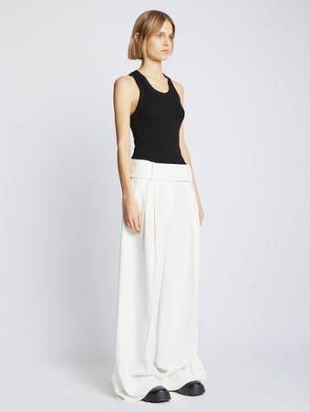 Side full length image of model wearing Matte Viscose Rib Knit Tank in BLACK