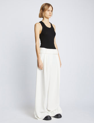 Side full length image of model wearing Matte Viscose Rib Knit Tank in BLACK