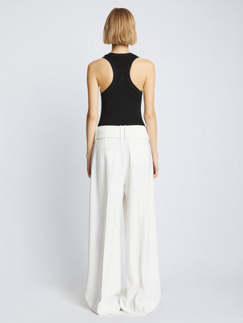 Back full length image of model wearing Matte Viscose Rib Knit Tank in BLACK