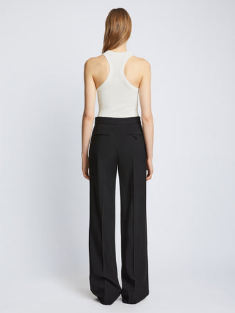 Back full length image of model wearing Matte Viscose Rib Knit Tank in WHITE