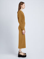 Side full length image of model wearing Silk Viscose Cardigan in OCHRE
