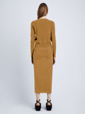 Back full length image of model wearing Silk Viscose Cardigan in OCHRE