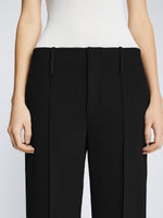Detail image of model wearing Bi-Stretch Crepe Cropped Pants in BLACK