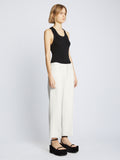 Side full length image of model wearing Bi-Stretch Crepe Cropped Pants in WHITE