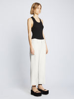 Side full length image of model wearing Bi-Stretch Crepe Cropped Pants in WHITE