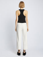 Back full length image of model wearing Bi-Stretch Crepe Cropped Pants in WHITE