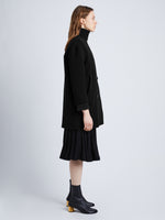 Side full length image of model wearing Technical Gabardine Peacoat in BLACK