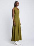 Side full length image of model wearing Matte Crepe Twist Back V-Neck Dress in OLIVE