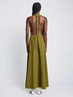 Back full length image of model wearing Matte Crepe Twist Back V-Neck Dress in OLIVE