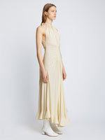 Side full length image of model wearing Crepe Jersey Ruched Dress in IVORY
