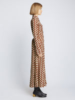 Side full length image of model wearing Printed Matte Jersey Shirt Dress in WINE/ECRU