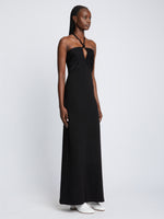Side full length image of model wearing Textured Cotton Knit Halter Dress in BLACK