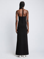 Back full length image of model wearing Textured Cotton Knit Halter Dress in BLACK