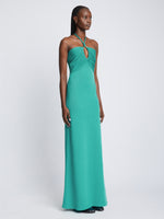 Side full length image of model wearing Textured Cotton Knit Halter Dress in TEAL