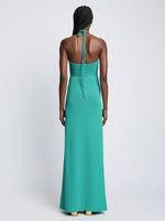Back full length image of model wearing Textured Cotton Knit Halter Dress in TEAL