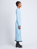 Side full length image of model wearing Silk Cashmere Rib Knit Sweater in LIGHT BLUE