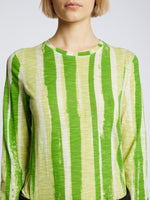 Detail image of model wearing Painted Stripe T-Shirt in GREEN MULTI