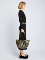 Image of model carrying Large Ruched Tote in OLIVE in hand
