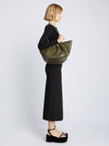 Image of model carrying Large Ruched Tote in OLIVE on shoulder