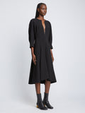 Side full length image of model wearing Matte Viscose Crepe Dress in BLACK