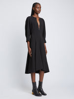 Side full length image of model wearing Matte Viscose Crepe Dress in BLACK