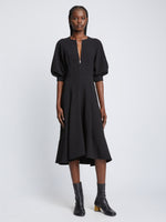 Front full length image of model wearing Matte Viscose Crepe Dress in BLACK with sleeves rolled up