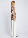 Side full length image of model wearing Printed Matte Jersey Shirt in WINE/ECRU