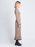Side full length image of model wearing Silk Cashmere Rib Knit Skirt in TAUPE