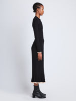Side full length image of model wearing Silk Cashmere Rib Knit Skirt in BLACK