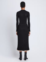 Back full length image of model wearing Silk Cashmere Rib Knit Skirt in BLACK