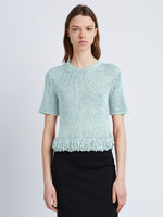 Front cropped image of model wearing Ribbon Crochet Fringe Top in PALE BLUE