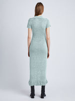 Side full length image of model wearing Ribbon Crochet Fringe Dress in PALE BLUE