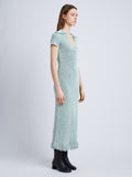 Back full length image of model wearing Ribbon Crochet Fringe Dress in PALE BLUE